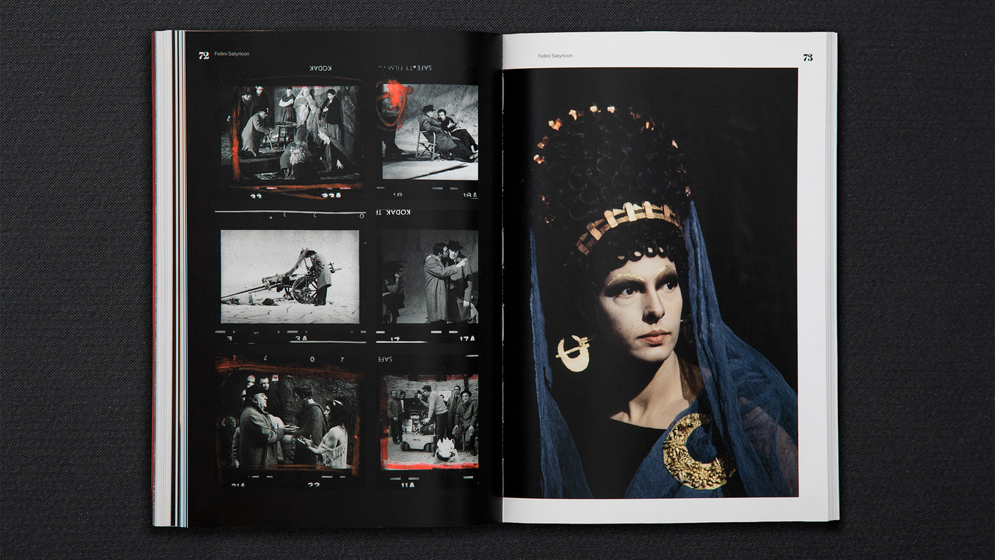 Open book showing a page with a black and white image of a person wearing a headscarf and gold jewelry.
